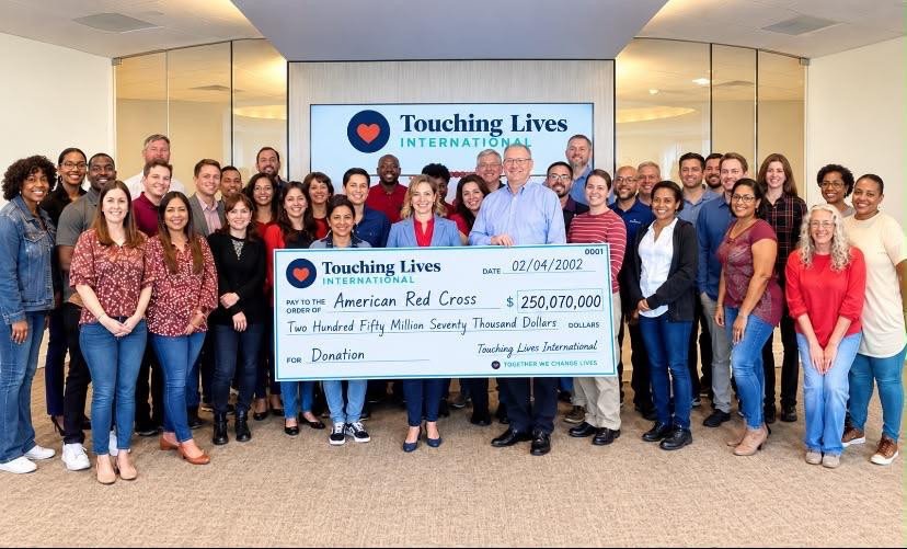 Group gathered around a presentation cheque