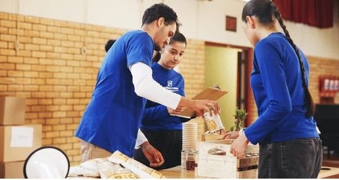 Volunteers distributing food and essential supplies