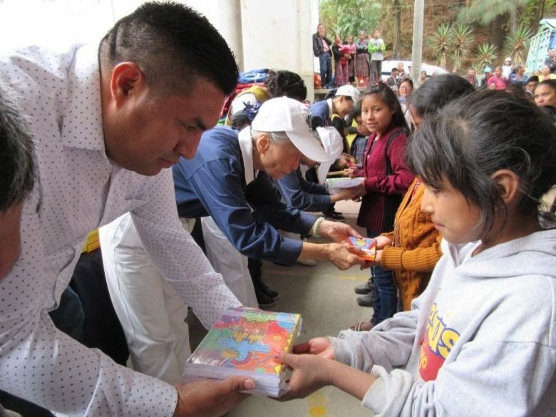 A gift being handed to a child